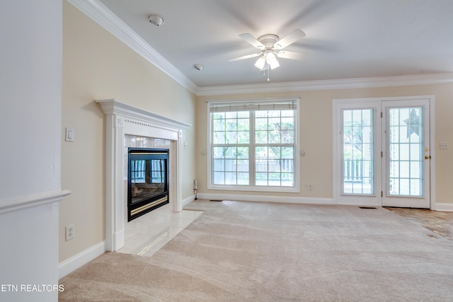 4913 Ivy Rose Dr, Knoxville, TN 37918 - unfurnished living room featuring carpet, crown molding, a premium fireplace, a ceiling fan, and baseboards
