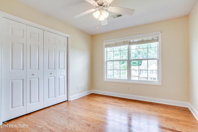 4913 Ivy Rose Dr, Knoxville, TN 37918 - unfurnished bedroom featuring light wood finished floors, baseboards, a closet, and a ceiling fan