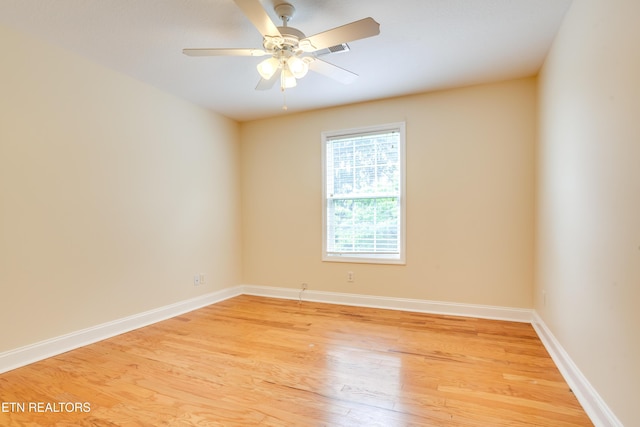 4913 Ivy Rose Dr, Knoxville, TN 37918 - spare room with light wood finished floors, a ceiling fan, and baseboards