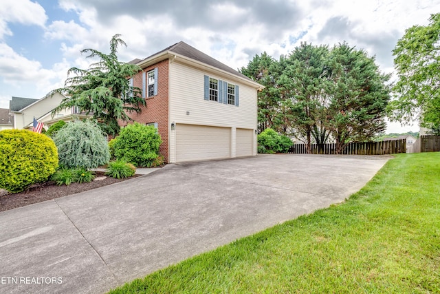 4913 Ivy Rose Dr, Knoxville, TN 37918 - view of property exterior with concrete driveway, an attached garage, and brick siding