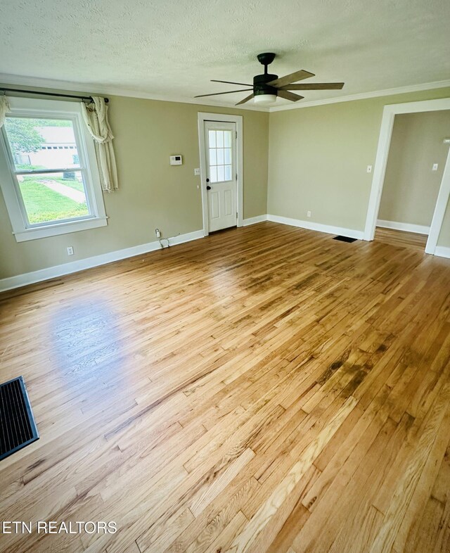 503 S Ruth St, Maryville, TN 37803 - empty room featuring wood finished floors, ceiling fan, baseboards, a textured ceiling, and crown molding