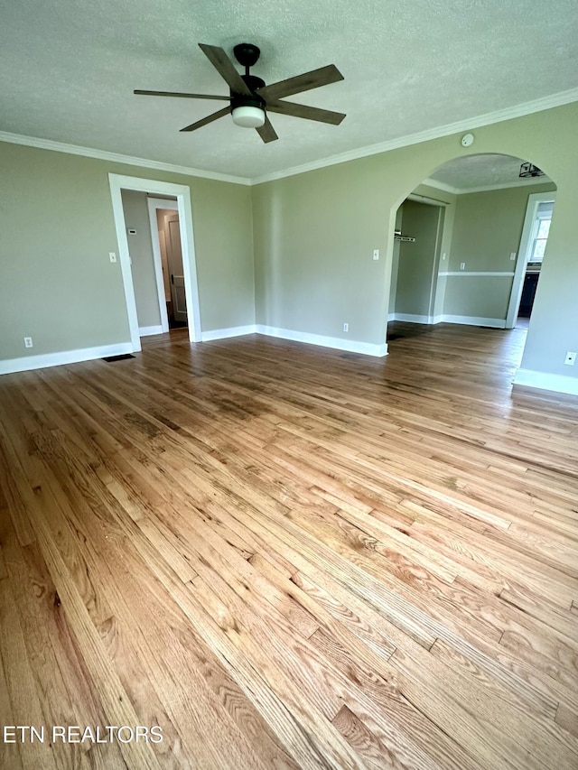 503 S Ruth St, Maryville, TN 37803 - unfurnished room with hardwood / wood-style flooring, arched walkways, a ceiling fan, baseboards, and a textured ceiling
