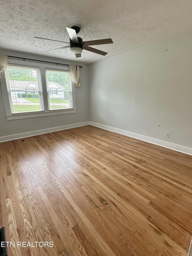 503 S Ruth St, Maryville, TN 37803 - empty room featuring wood finished floors, baseboards, a textured ceiling, and ceiling fan