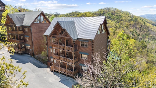 1032 Black Bear Cub Way, Sevierville, TN 37862 - view of front of home featuring a balcony, log siding, and metal roof