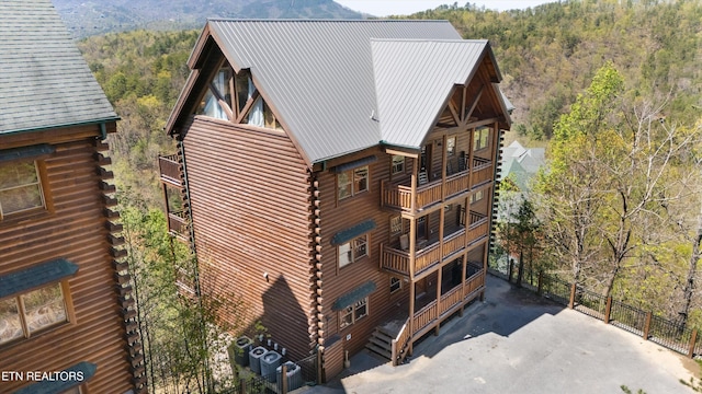 1032 Black Bear Cub Way, Sevierville, TN 37862 - view of side of property with log exterior, a wooded view, and a balcony