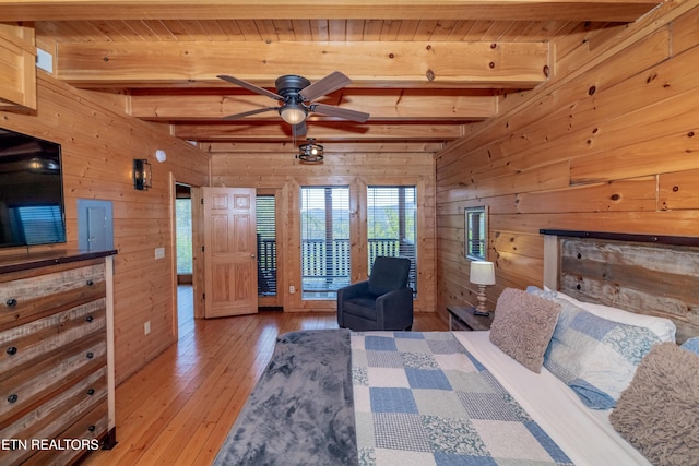 1032 Black Bear Cub Way, Sevierville, TN 37862 - bedroom with wooden walls, beam ceiling, wood ceiling, hardwood / wood-style floors, and access to outside