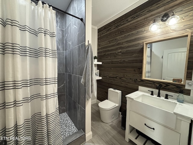 3152 Bridgewater Blvd, Morristown, TN 37814 - full bath with wood walls, toilet, tiled shower, vanity, and wood finished floors