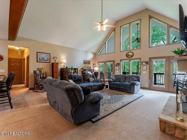 3428 Connie Ln, White Pine, TN 37890 - living area with ceiling fan, light colored carpet, high vaulted ceiling, and healthy amount of natural light