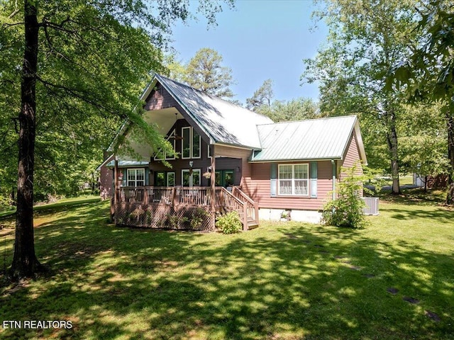 3428 Connie Ln, White Pine, TN 37890 - rear view of property featuring a wooden deck, a lawn, metal roof, and crawl space