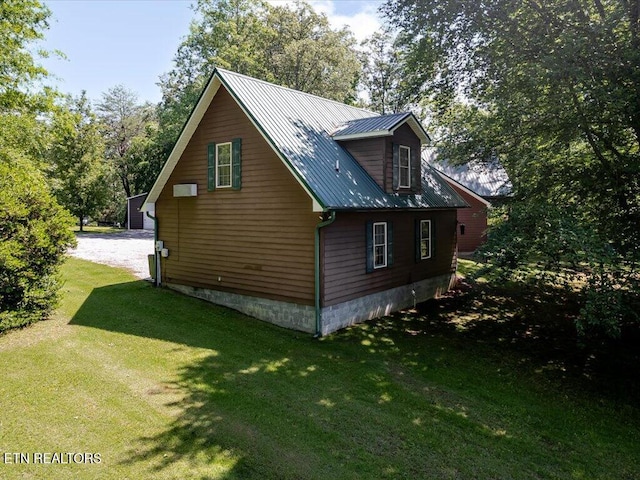 3428 Connie Ln, White Pine, TN 37890 - view of property exterior featuring metal roof, a yard, and driveway