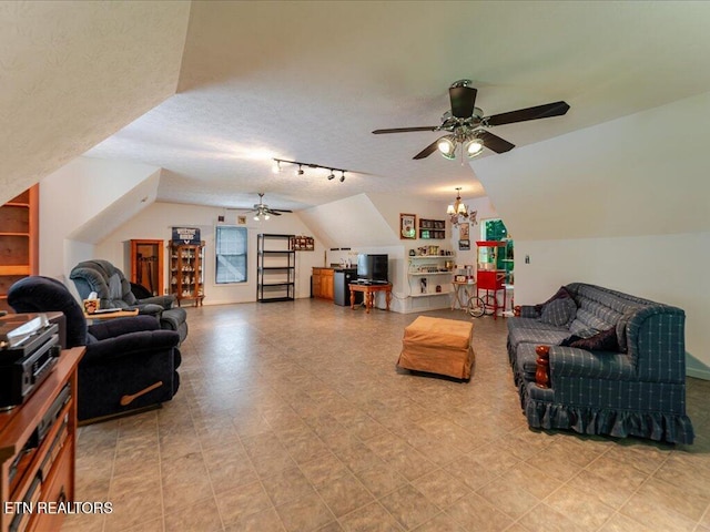 3428 Connie Ln, White Pine, TN 37890 - living area with a ceiling fan, vaulted ceiling, track lighting, and a textured ceiling