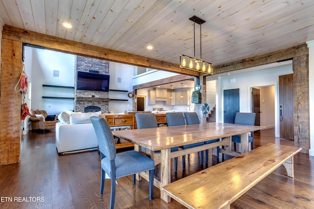 1510 Hickory Pointe Ln, Maynardville, TN 37807 - dining room with dark wood-style flooring, a fireplace, recessed lighting, and a wooden ceiling with exposed beams