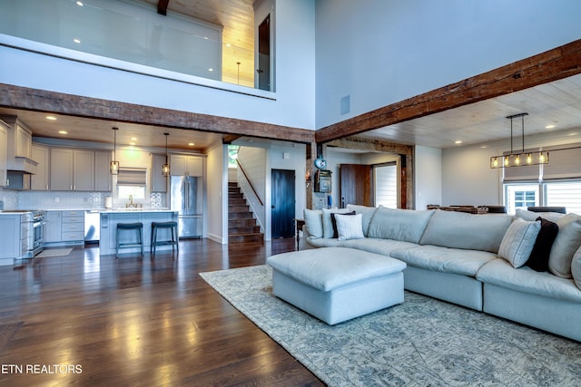 1510 Hickory Pointe Ln, Maynardville, TN 37807 - living area with a high ceiling, dark wood-style flooring, and stairs