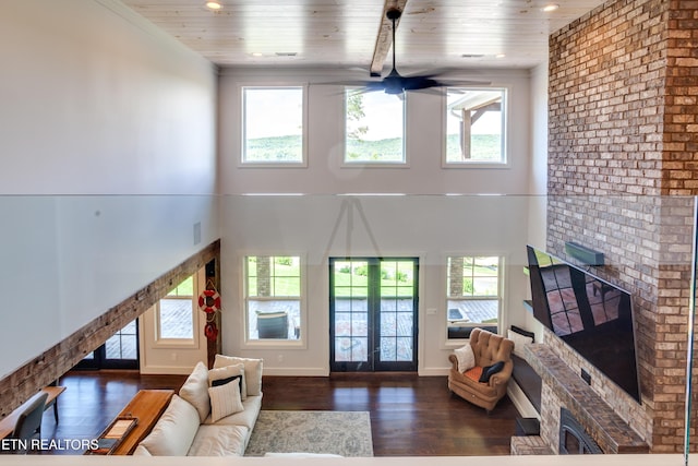 1510 Hickory Pointe Ln, Maynardville, TN 37807 - living area featuring a brick fireplace, wooden ceiling, wood finished floors, a high ceiling, and a ceiling fan