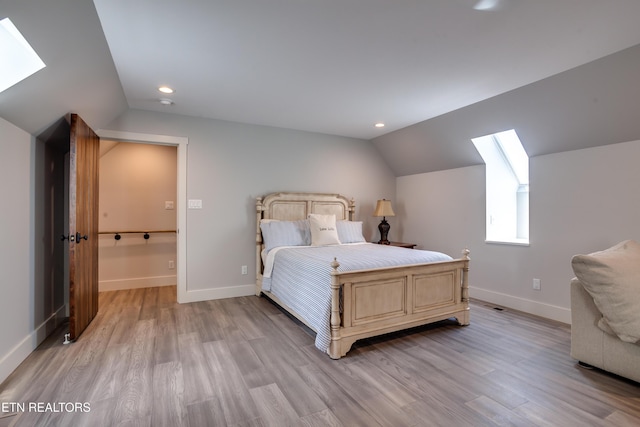 1510 Hickory Pointe Ln, Maynardville, TN 37807 - bedroom with a skylight, vaulted ceiling, light wood-type flooring, and recessed lighting