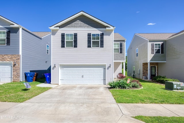 162 Harbour Pointe Ln, Oak Ridge, TN 37830 - view of front facade featuring a garage, concrete driveway, and a front yard