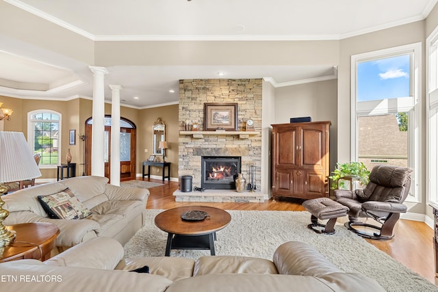 170 Blue Jay Ave, Vonore, TN 37885 - living room with light wood-type flooring, crown molding, a stone fireplace, recessed lighting, and decorative columns