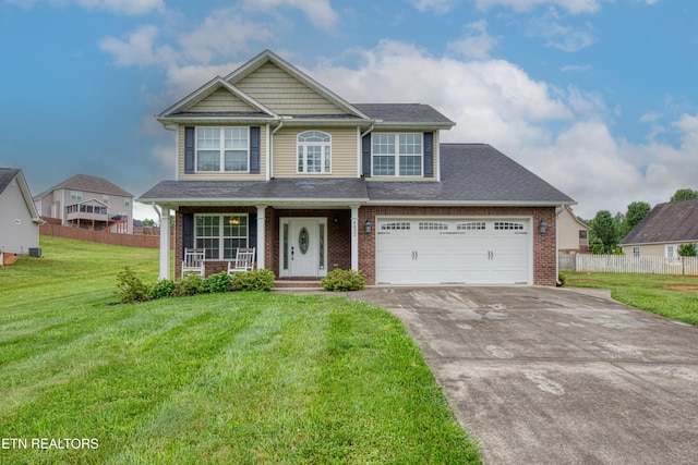 4432 Old Colony Ln, Morristown, TN 37814 - view of front of home with driveway, brick siding, covered porch, a garage, and roof with shingles