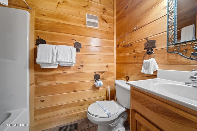 2006 Cougar Crossing Way, Sevierville, TN 37862 - bathroom with toilet, tile patterned flooring, vanity, a shower, and wooden walls