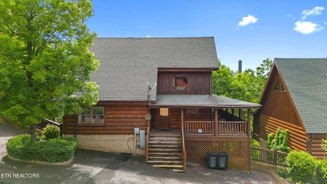 2006 Cougar Crossing Way, Sevierville, TN 37862 - log-style house with roof with shingles, stairway, log siding, and covered porch