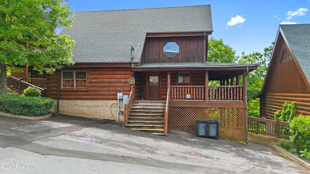 2006 Cougar Crossing Way, Sevierville, TN 37862 - log home featuring roof with shingles, covered porch, and log siding