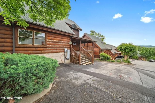 2006 Cougar Crossing Way, Sevierville, TN 37862 - view of front facade with stairs, roof with shingles, and faux log siding