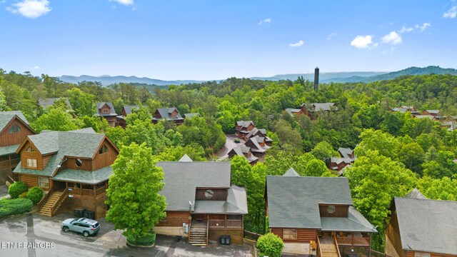 2006 Cougar Crossing Way, Sevierville, TN 37862 - aerial perspective of suburban area featuring a mountainous background and a forest