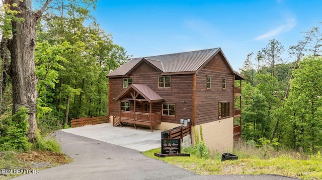 chalet / cabin featuring metal roof