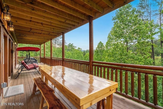 deck featuring outdoor dining area