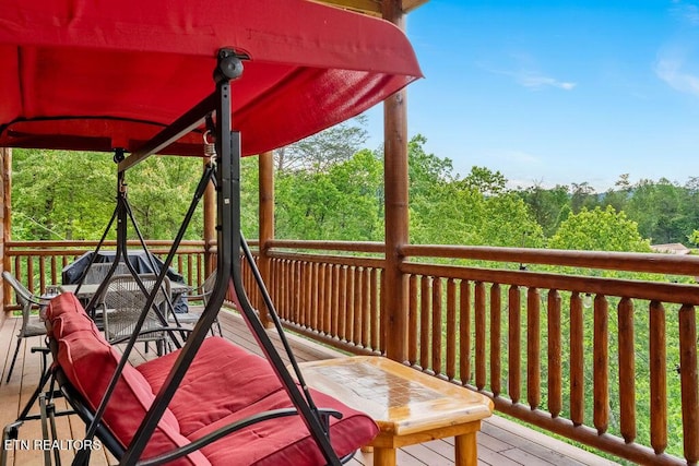 wooden deck with outdoor dining area