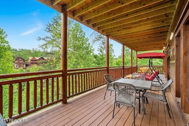 deck featuring outdoor dining area