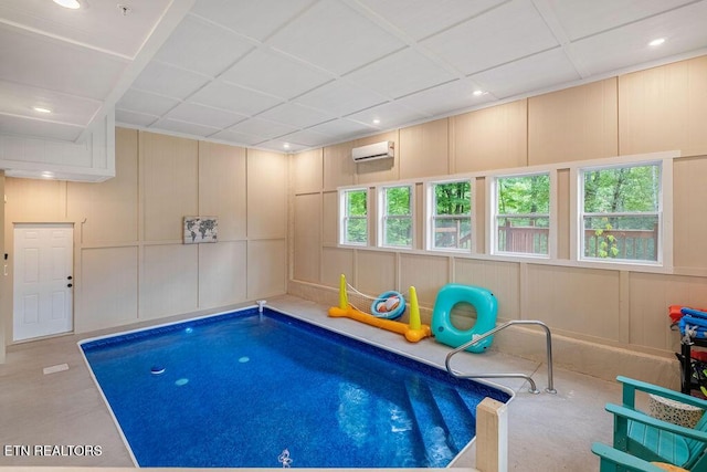 view of swimming pool featuring a wall mounted air conditioner