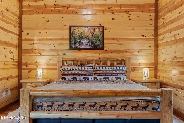 bedroom with wood walls
