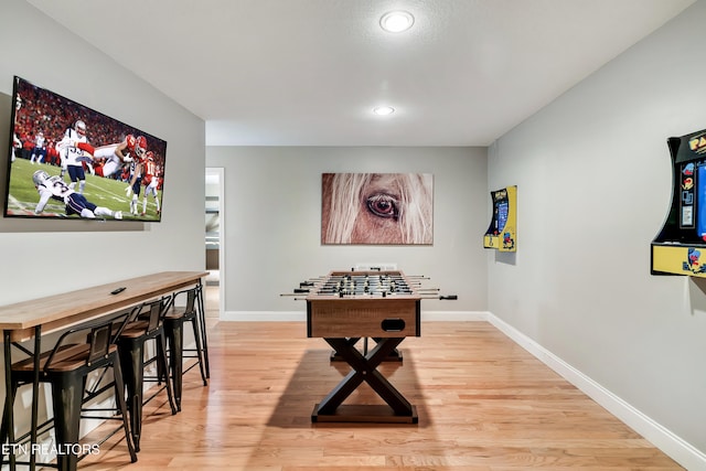 game room with light wood-type flooring, baseboards, and recessed lighting