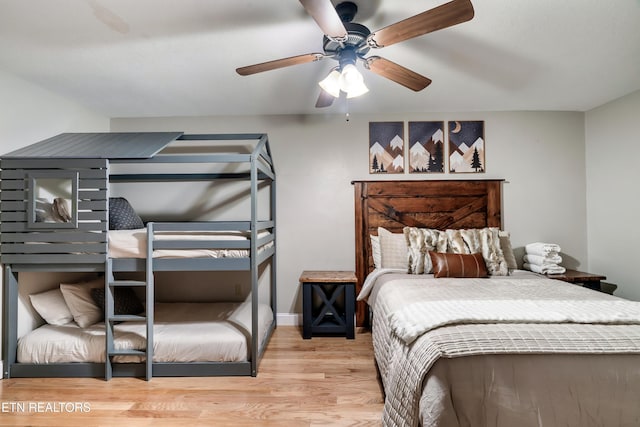 bedroom with wood finished floors and a ceiling fan