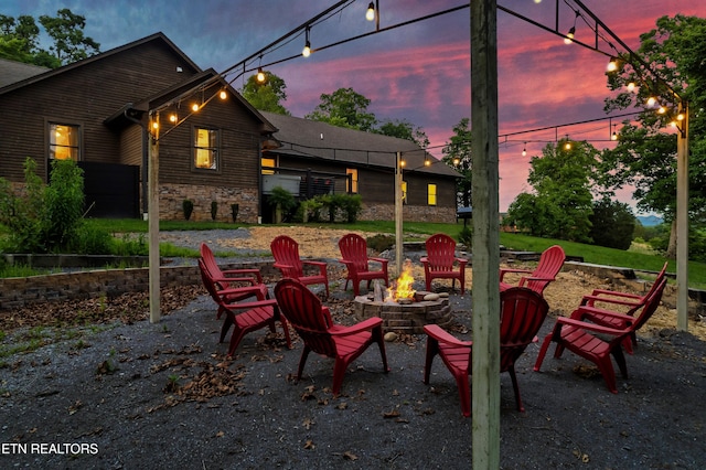 view of patio / terrace featuring an outdoor fire pit