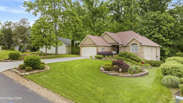 view of front of property with asphalt driveway, a front yard, a garage, and brick siding