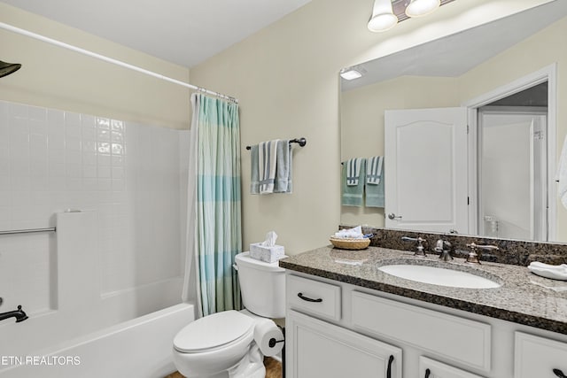 bathroom with shower / tub combo, vanity, and toilet