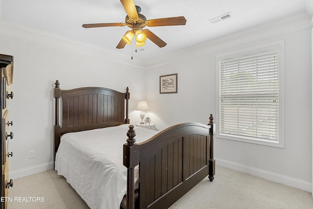 bedroom with light carpet, baseboards, crown molding, and ceiling fan