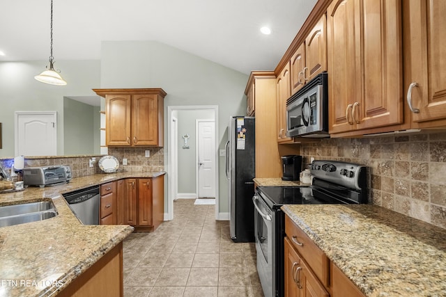 kitchen featuring stainless steel appliances, backsplash, light stone countertops, brown cabinetry, and hanging light fixtures
