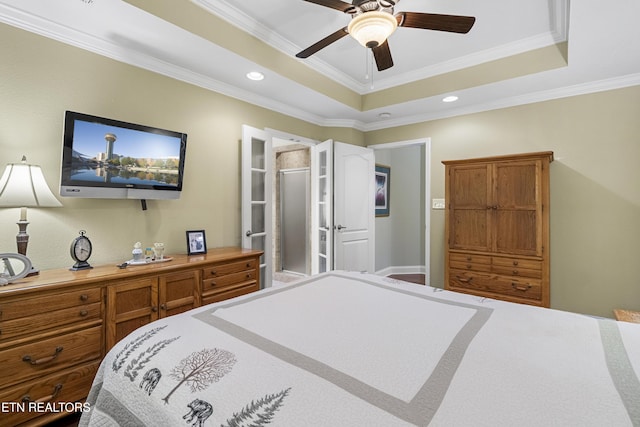 bedroom featuring a raised ceiling, ornamental molding, recessed lighting, and a ceiling fan
