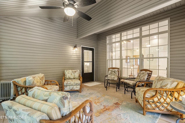 sitting room with a ceiling fan