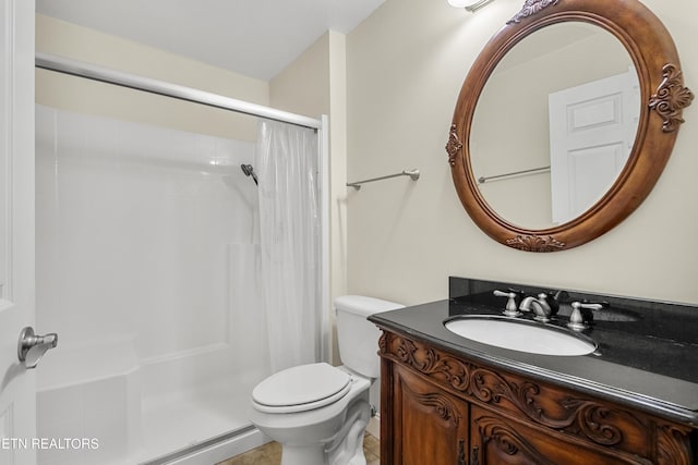 bathroom featuring toilet, curtained shower, vanity, and tile patterned floors