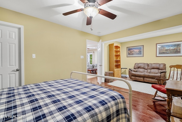 bedroom featuring wood finished floors and ceiling fan