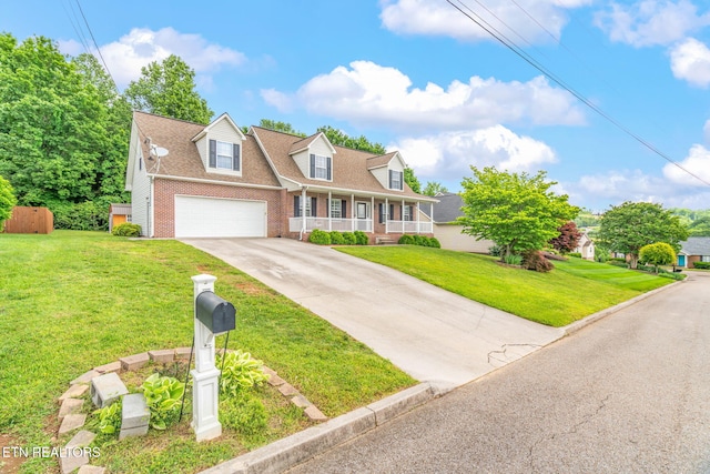 4419 Alder Tree Ln, Knoxville, TN 37938 - cape cod home with covered porch, brick siding, driveway, and a front lawn