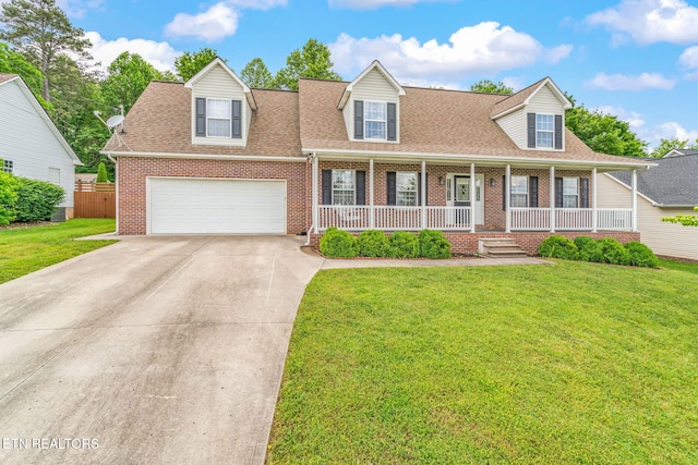 4419 Alder Tree Ln, Knoxville, TN 37938 - cape cod house with brick siding, driveway, roof with shingles, and a porch