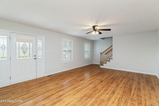 4419 Alder Tree Ln, Knoxville, TN 37938 - entryway with stairs, light wood finished floors, ceiling fan, and baseboards