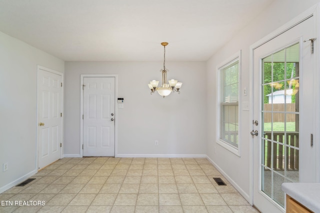 4419 Alder Tree Ln, Knoxville, TN 37938 - unfurnished dining area featuring a chandelier, healthy amount of natural light, and baseboards