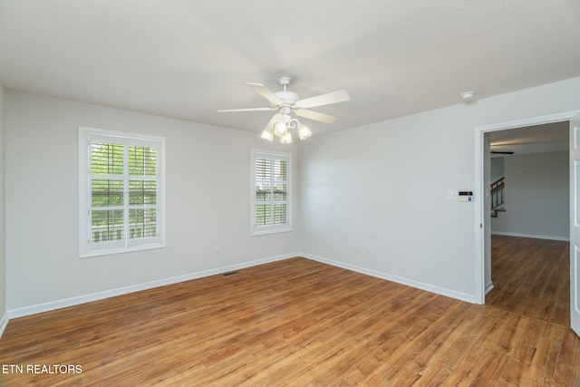 4419 Alder Tree Ln, Knoxville, TN 37938 - spare room with light wood finished floors, healthy amount of natural light, baseboards, and ceiling fan