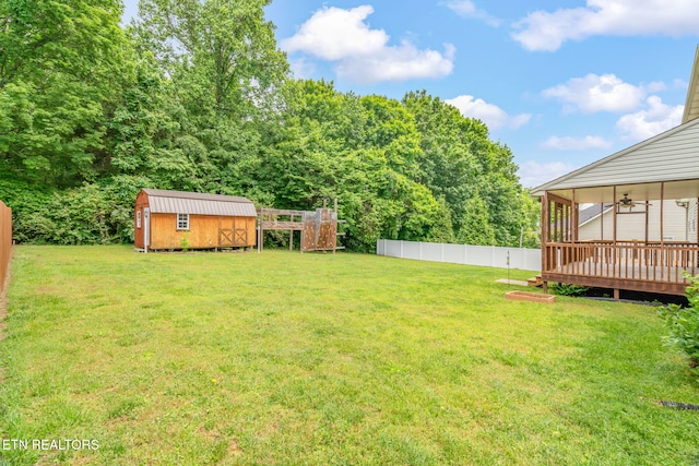4419 Alder Tree Ln, Knoxville, TN 37938 - view of yard with a shed, an outbuilding, a deck, and ceiling fan